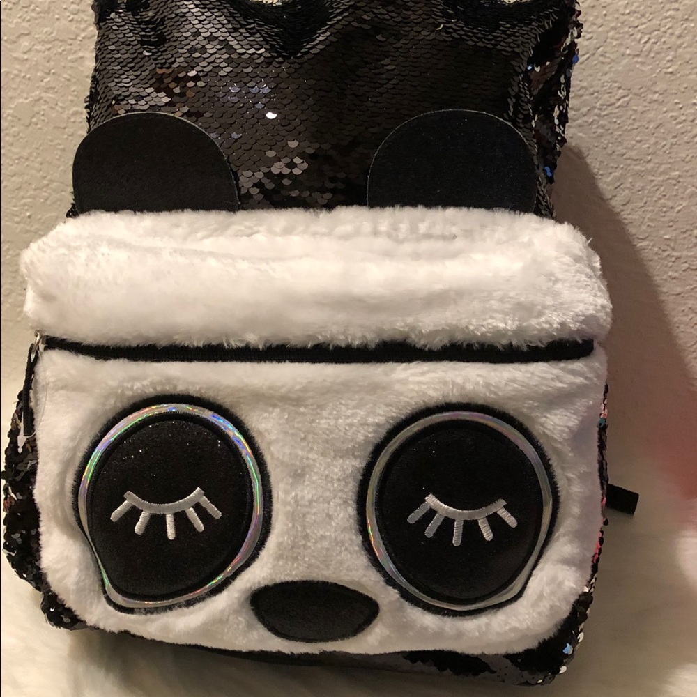 Beautiful eyes backpack with black sequins.